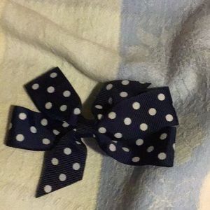 Navy bow with polka dots.